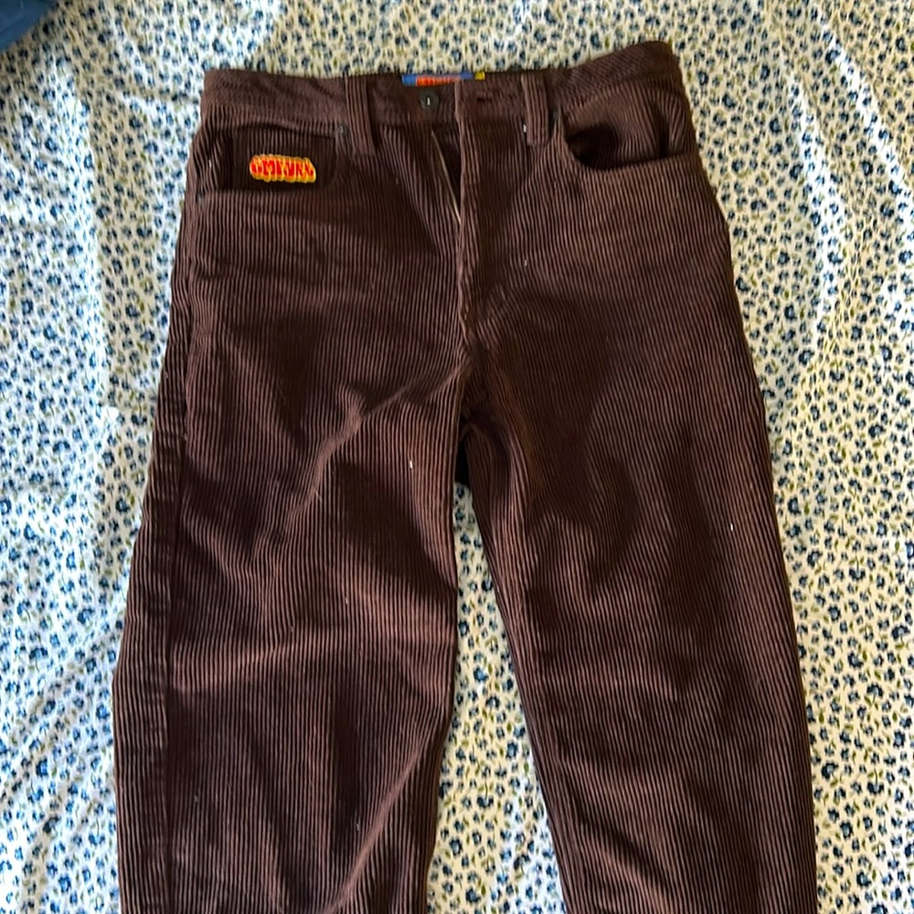 Zumiez, 27, brown corduroy empyre pants.  The pants run a little small